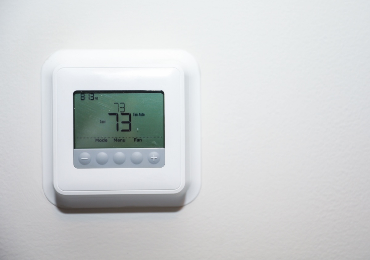 a programmable thermostat set to 73 degrees