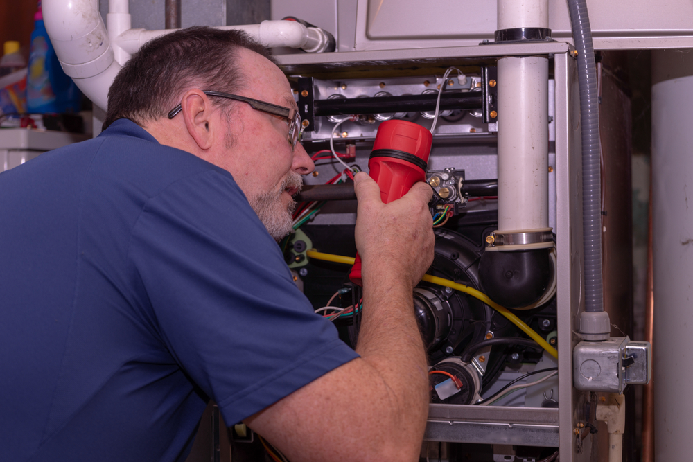 professional technician performing a furnace tune-up